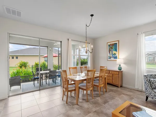 a view of a dining room with furniture window and outside view