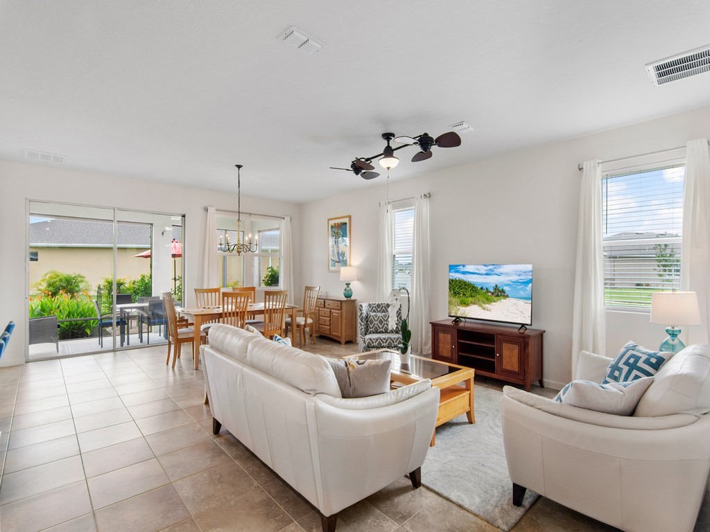 2040 Amazon Way Southwest Vero Beach, FL 32962 - Photo 9 of 35 a living room with furniture and a large window