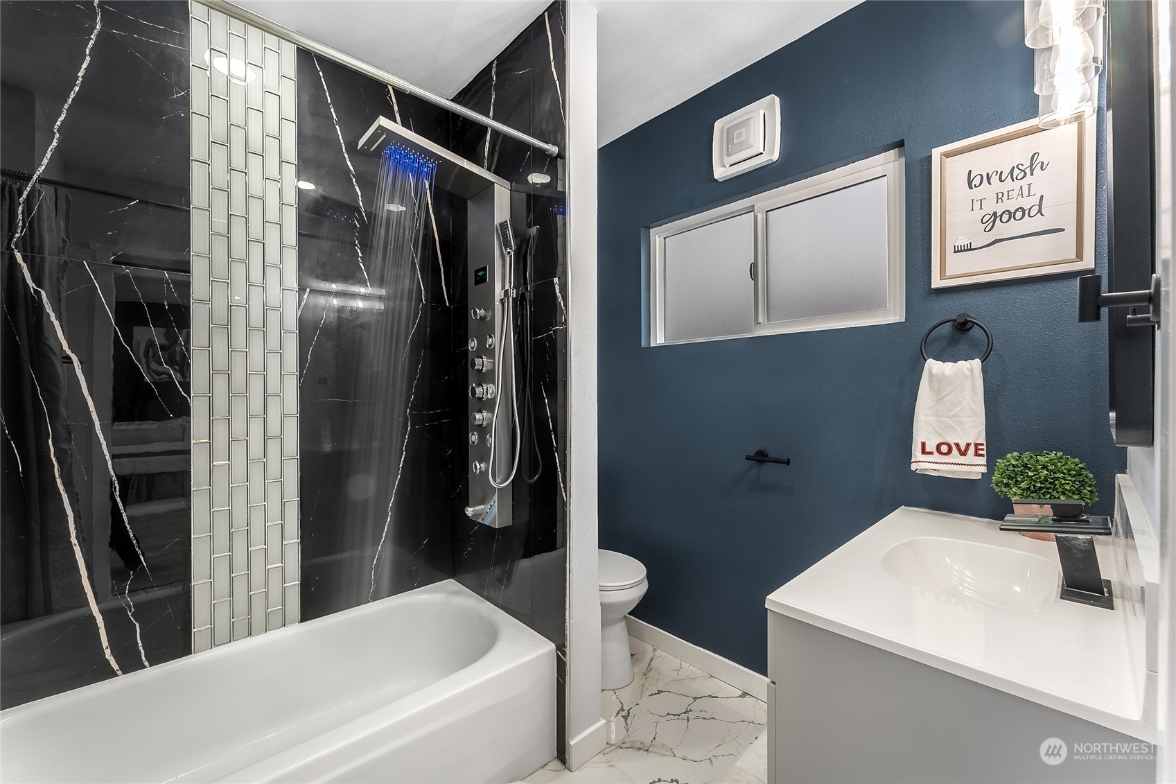 3217 South Durango Street Tacoma, WA 98409 - Photo 11 of 21 a bathroom with a bathtub and shower