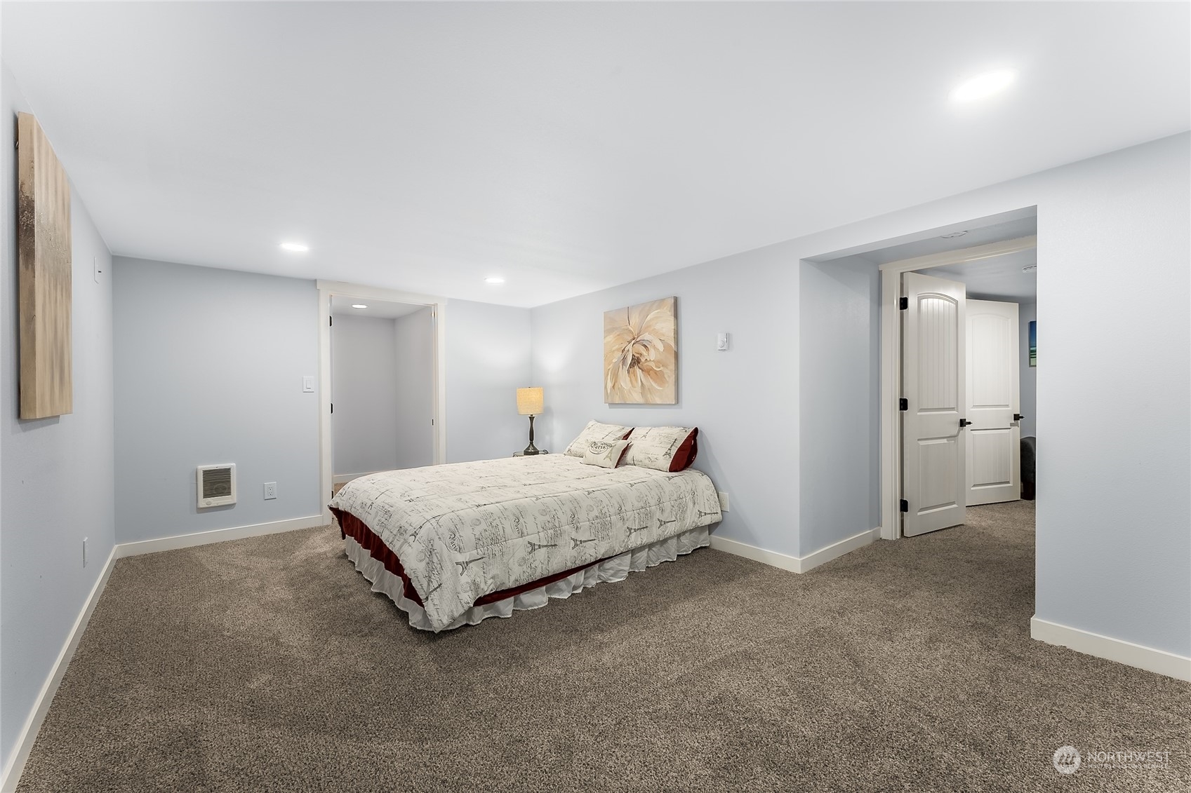 3217 South Durango Street Tacoma, WA 98409 - Photo 14 of 21 a spacious bedroom with a bed and a painting on the wall