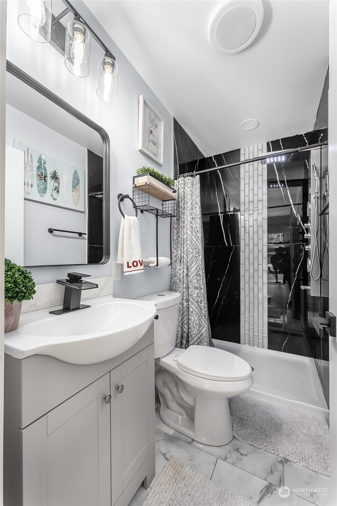 3217 South Durango Street Tacoma, WA 98409 - Photo 18 of 21 a bathroom with a sink toilet and shower