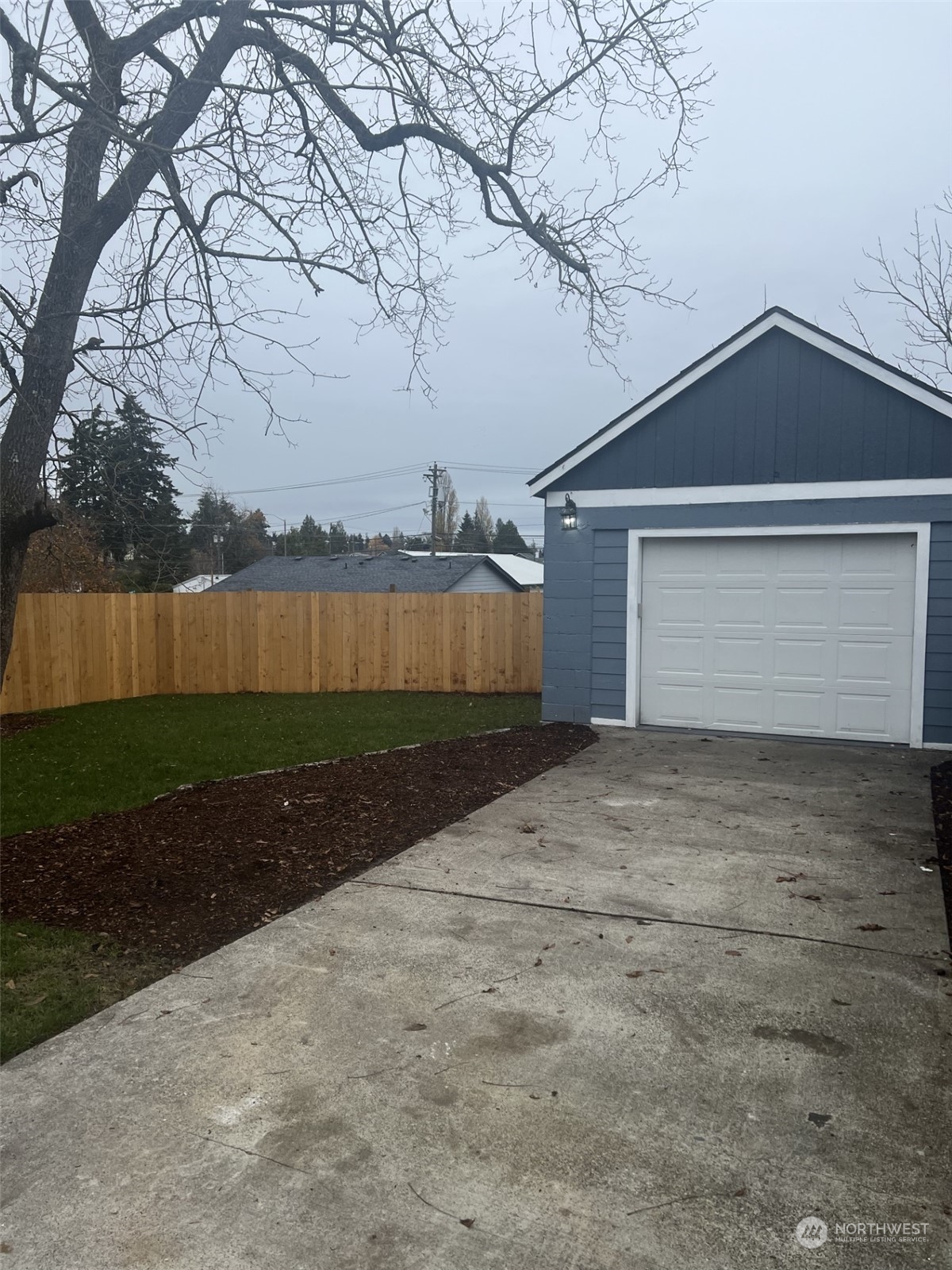 3217 South Durango Street Tacoma, WA 98409 - Photo 21 of 21 a front view of a house with a yard and garage