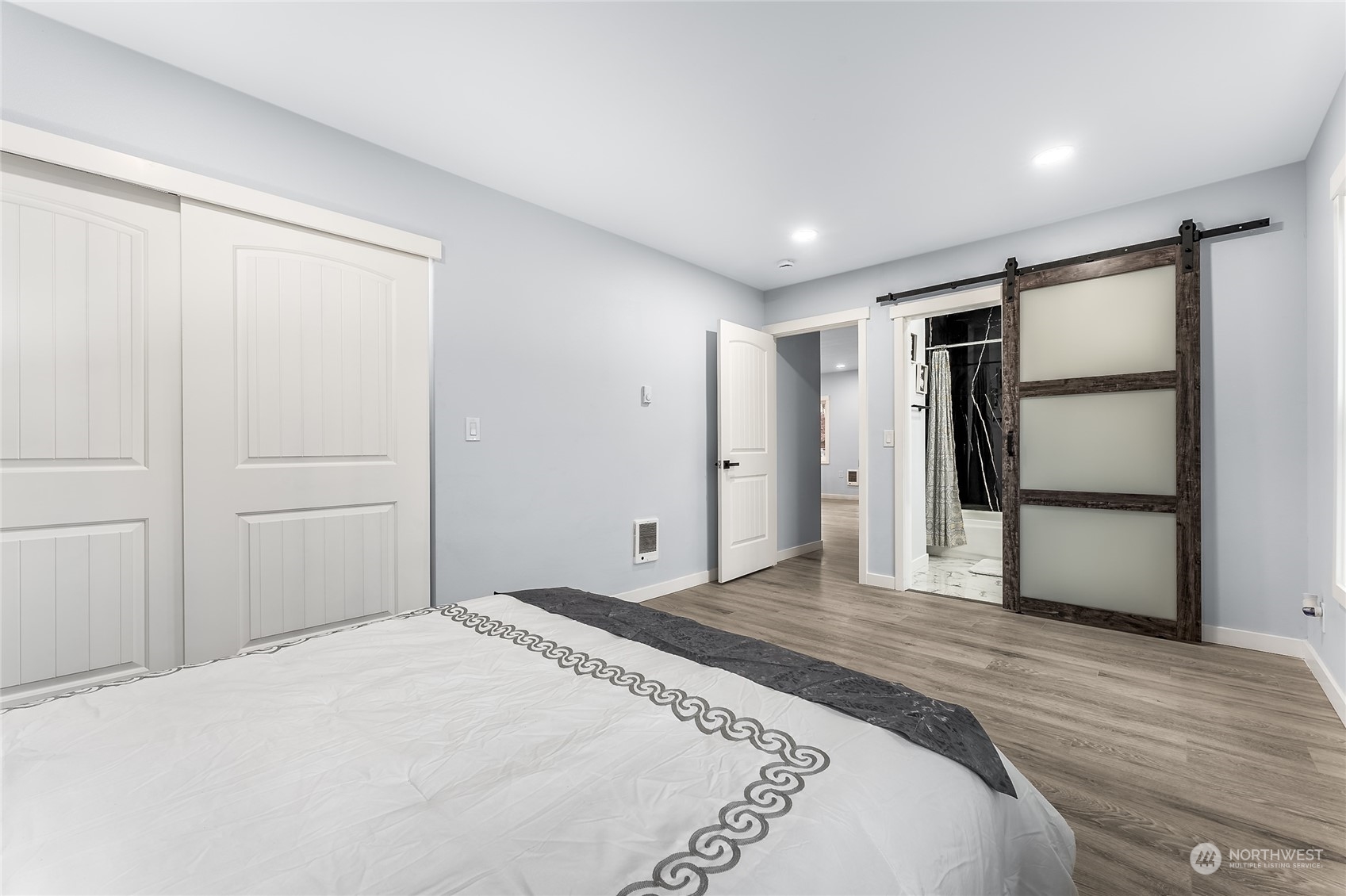 3217 South Durango Street Tacoma, WA 98409 - Photo 10 of 21 a bedroom with a bed and wooden floor