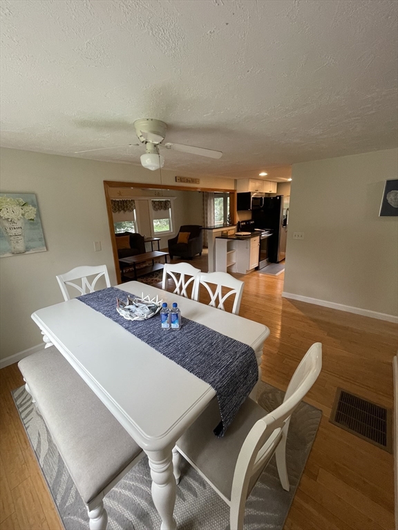 a view of a dining room with furniture