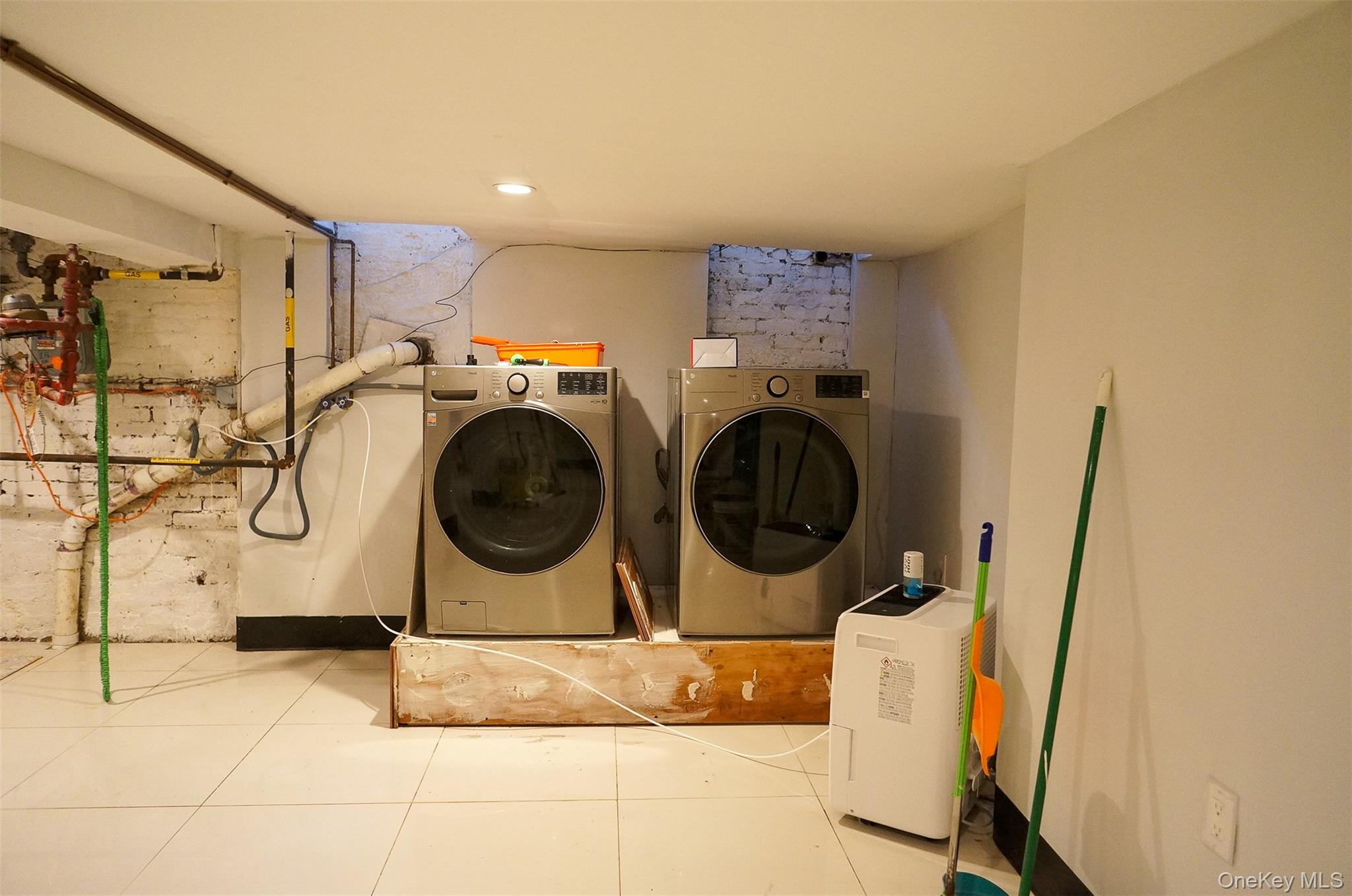 526 East 148th Street, Unit 1 Bronx, NY 10455 - Photo 12 of 13 a utility room with dryer and washer