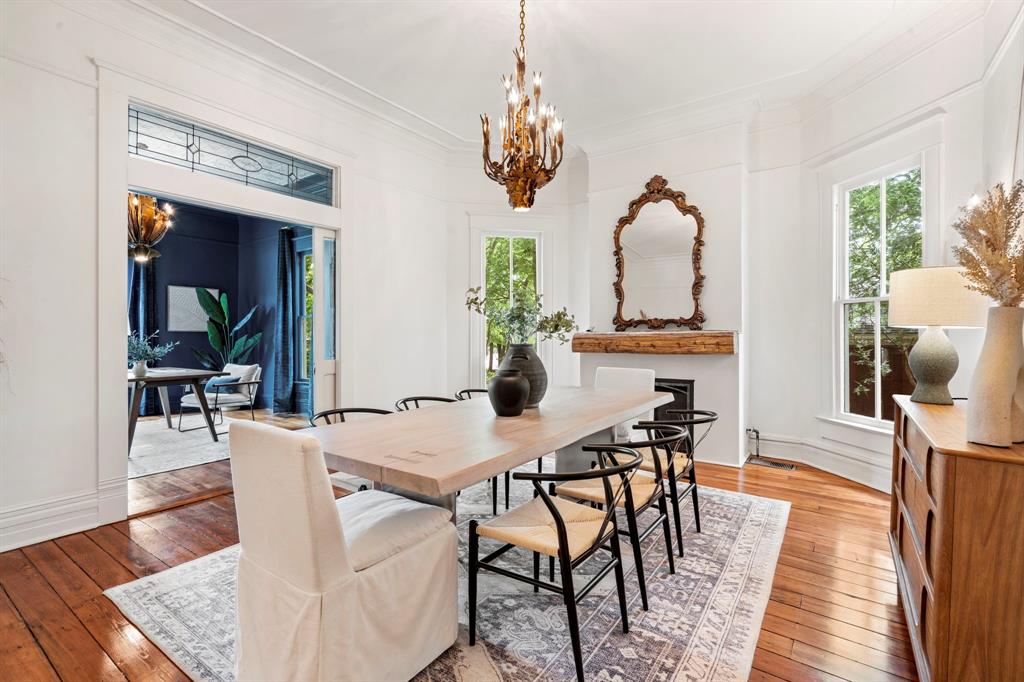 1502 West Virginia Street McKinney, TX 75069 - Photo 9 of 40 a view of a dining room with furniture and wooden floor