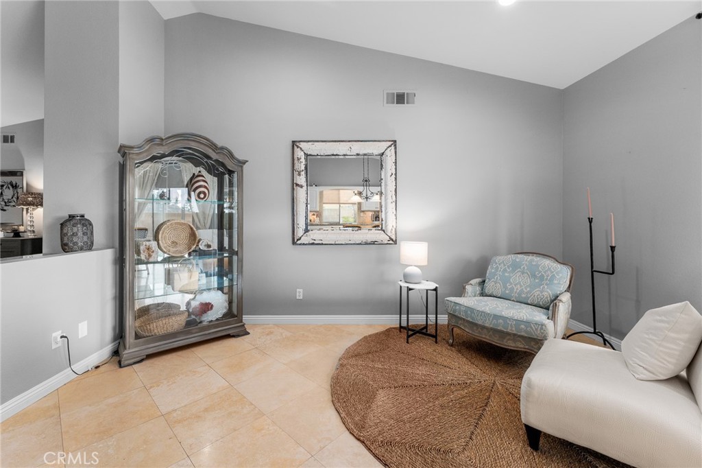 4021 North Larkspur Avenue Rialto, CA 92377 - Photo 14 of 40 a living room with furniture and a window