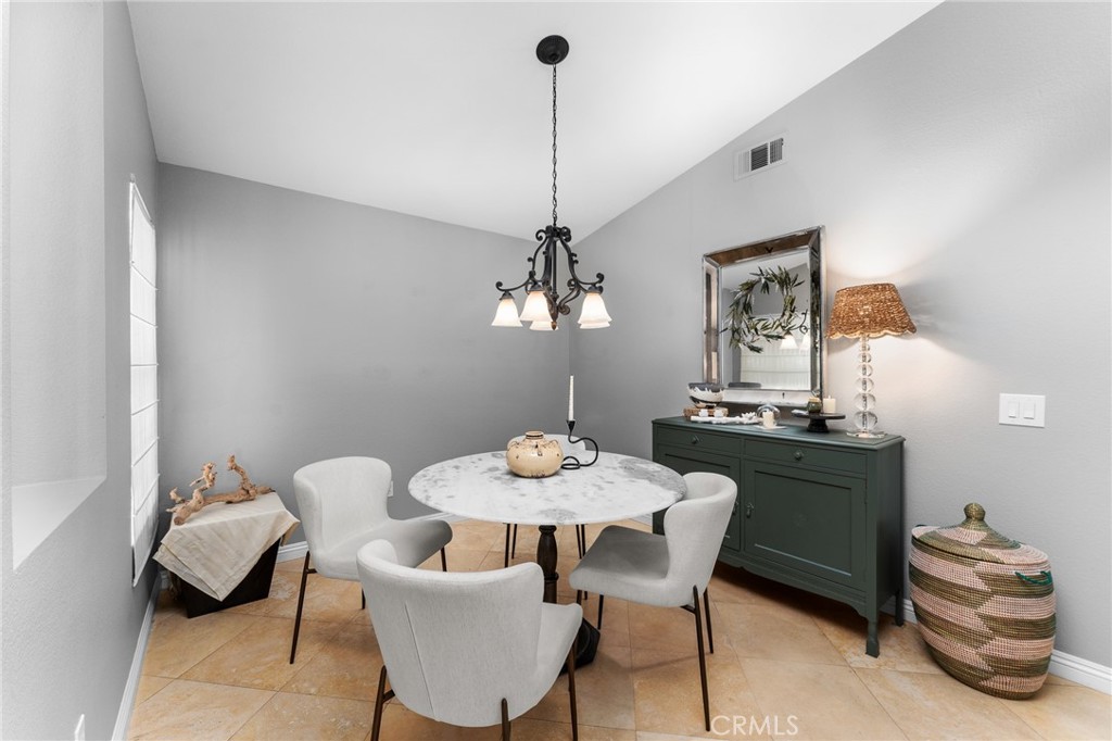 4021 North Larkspur Avenue Rialto, CA 92377 - Photo 17 of 40 a dining room with furniture and window