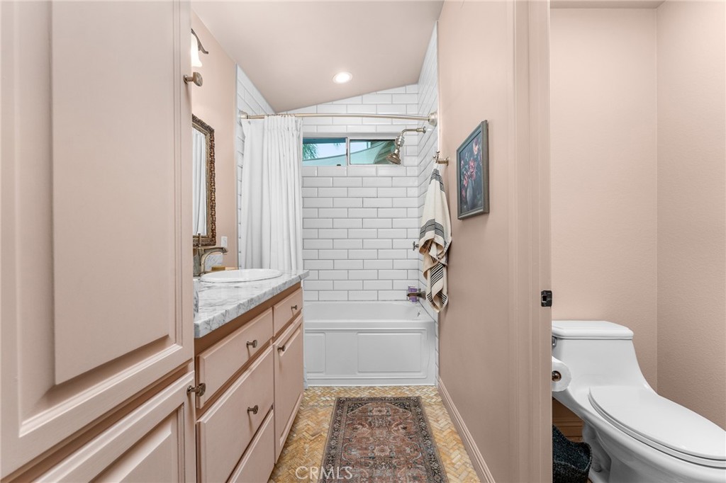 4021 North Larkspur Avenue Rialto, CA 92377 - Photo 26 of 40 a bathroom with a granite countertop sink toilet and shower