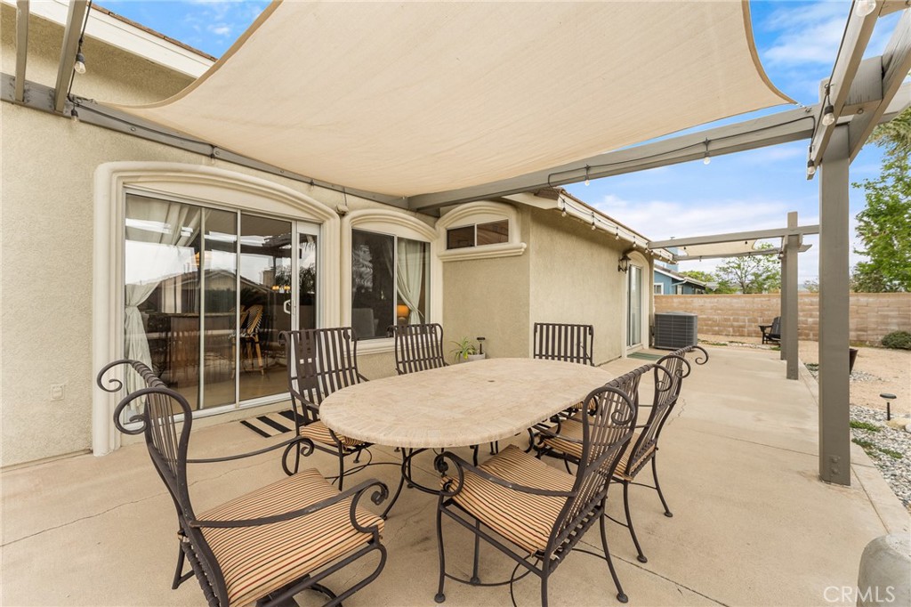4021 North Larkspur Avenue Rialto, CA 92377 - Photo 30 of 40 a view of a dining room and livingroom with furniture