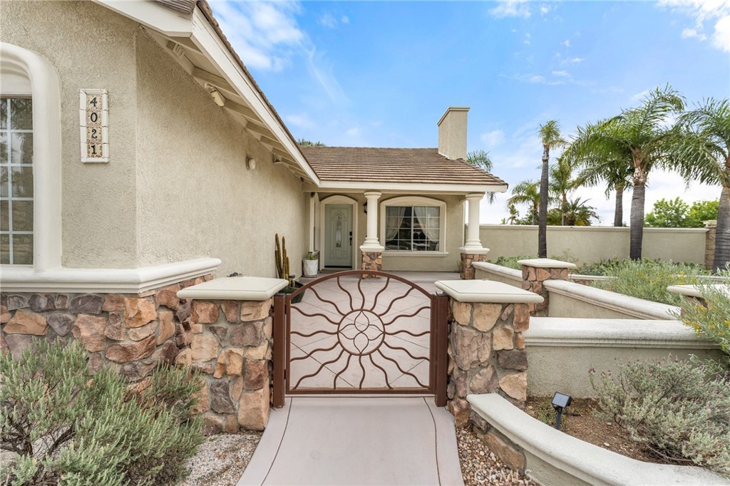 4021 North Larkspur Avenue Rialto, CA 92377 - Photo 5 of 40 a view of a patio with couches table and chairs and potted plants