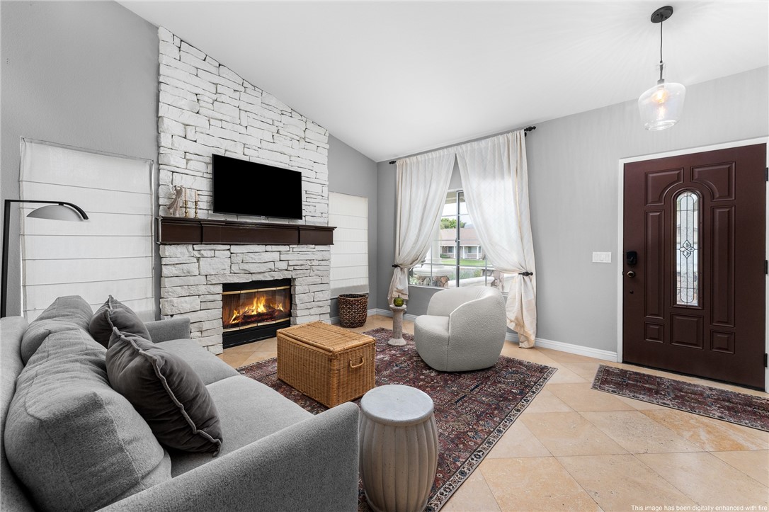 4021 North Larkspur Avenue Rialto, CA 92377 - Photo 9 of 40 a living room with furniture and a fireplace