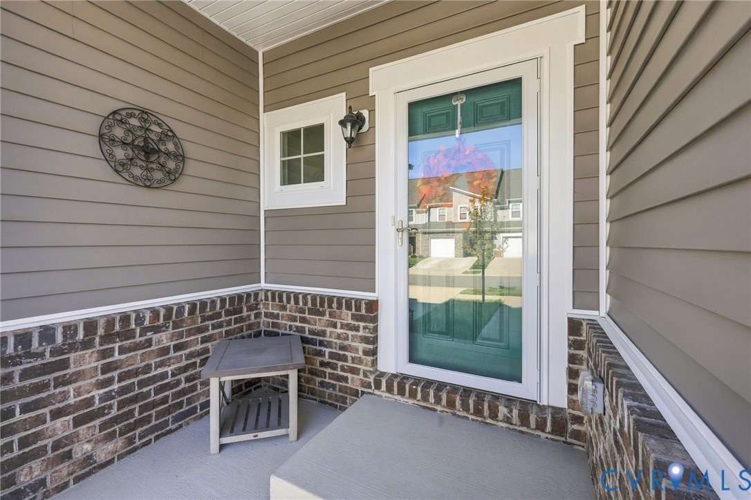 12824 Deep Wl Road Midlothian, VA 23112 - Photo 3 of 42 Entryway featuring a storm door, sconce lighting,