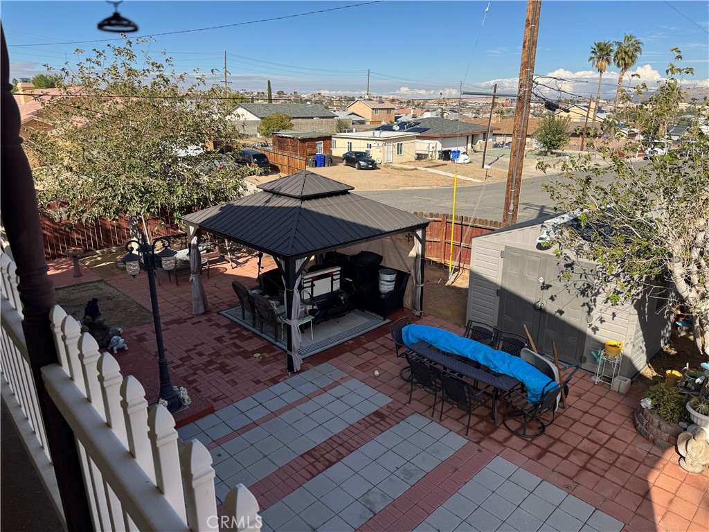 751 Rimrock Road Barstow, CA 92311 - Photo 16 of 33 a terrace with outdoor seating and wooden benches