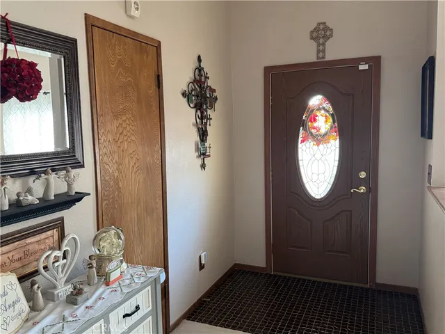 a view of a entryway door with wooden floor