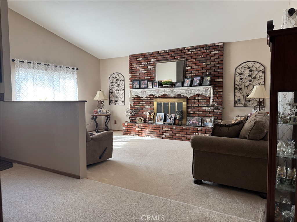 751 Rimrock Road Barstow, CA 92311 - Photo 3 of 33 a living room with furniture and a flat screen tv