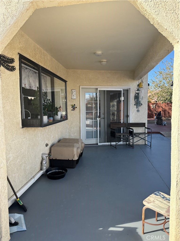 751 Rimrock Road Barstow, CA 92311 - Photo 32 of 33 a living room with furniture and a flat screen tv