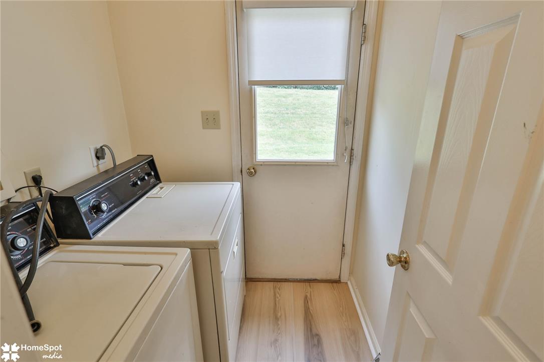 4059 Wedgewood Road Allentown, PA 18104 - Photo 31 of 72 Functional laundry space featuring modern appliances and light wood flooring.
