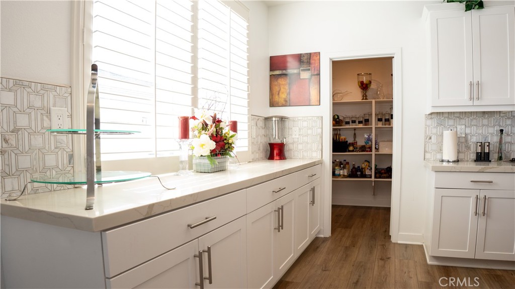 2411 Huron Road Rialto, CA 92377 - Photo 11 of 46 a kitchen with stainless steel appliances a sink and cabinets