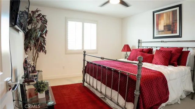 a bedroom with a bed and window