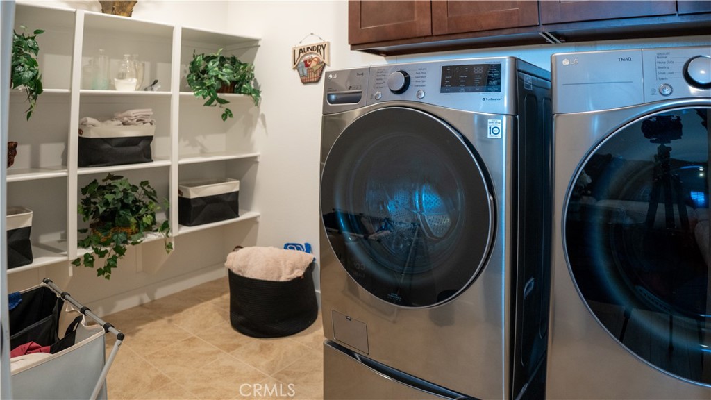 2411 Huron Road Rialto, CA 92377 - Photo 20 of 46 a close view of a utility room with dryer and washer