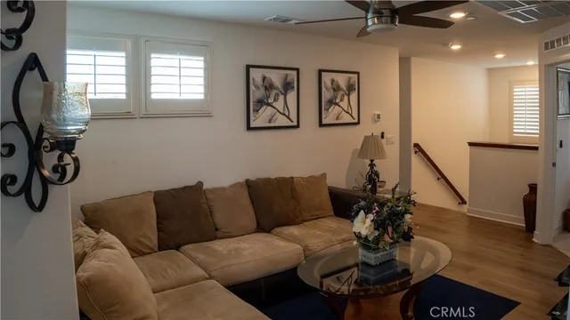a dining room with furniture and a chandelier