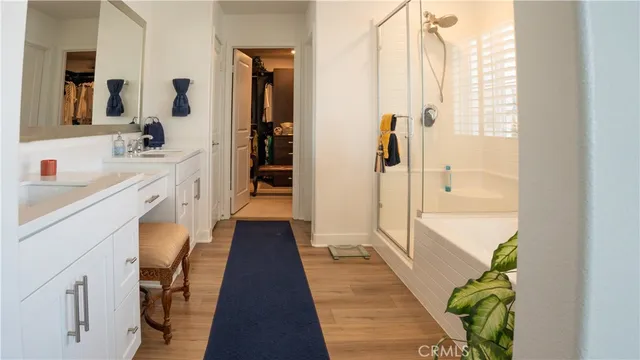 a bathroom with a tub and a shower