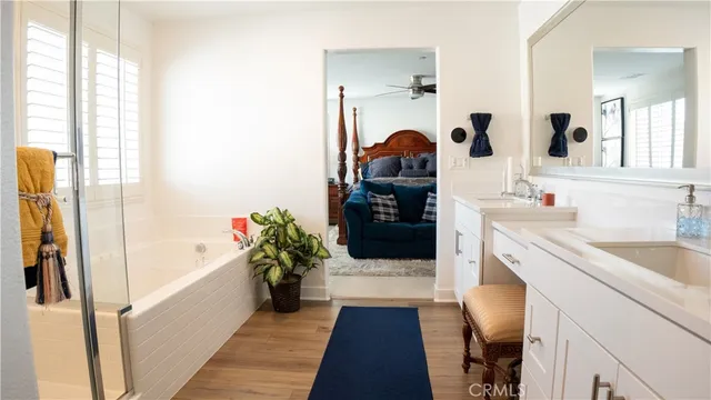 a view of walk in closet with clothes