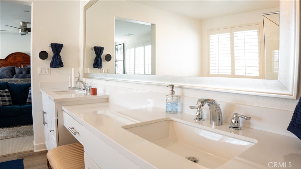 2411 Huron Road Rialto, CA 92377 - Photo 30 of 46 a bathroom with a sink and a large mirror