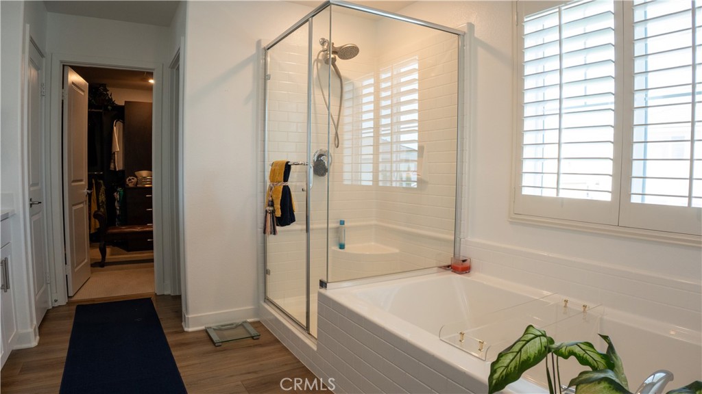2411 Huron Road Rialto, CA 92377 - Photo 32 of 46 a bathroom with a tub and a shower