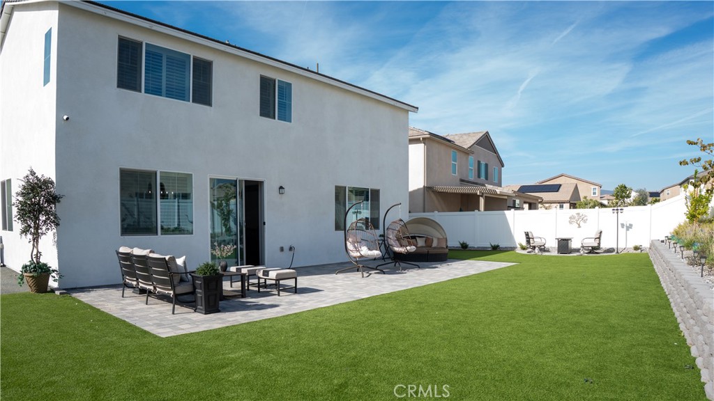 2411 Huron Road Rialto, CA 92377 - Photo 36 of 46 a view of a house with backyard porch and sitting area