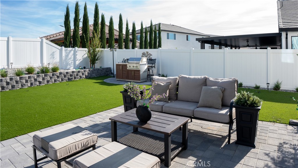 2411 Huron Road Rialto, CA 92377 - Photo 38 of 46 a outdoor living space with furniture and a garden