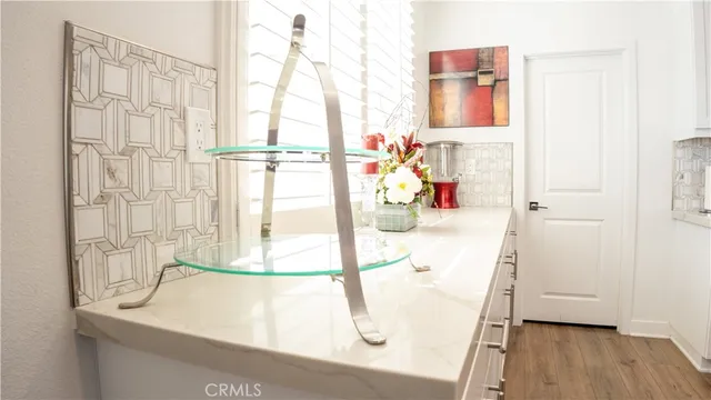 a kitchen with stainless steel appliances a sink and cabinets