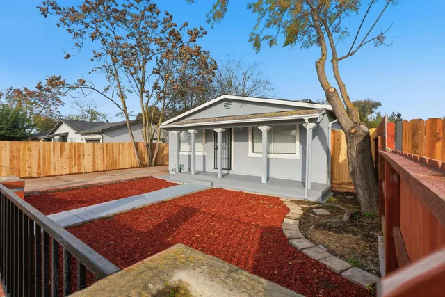 a front view of a house with garden