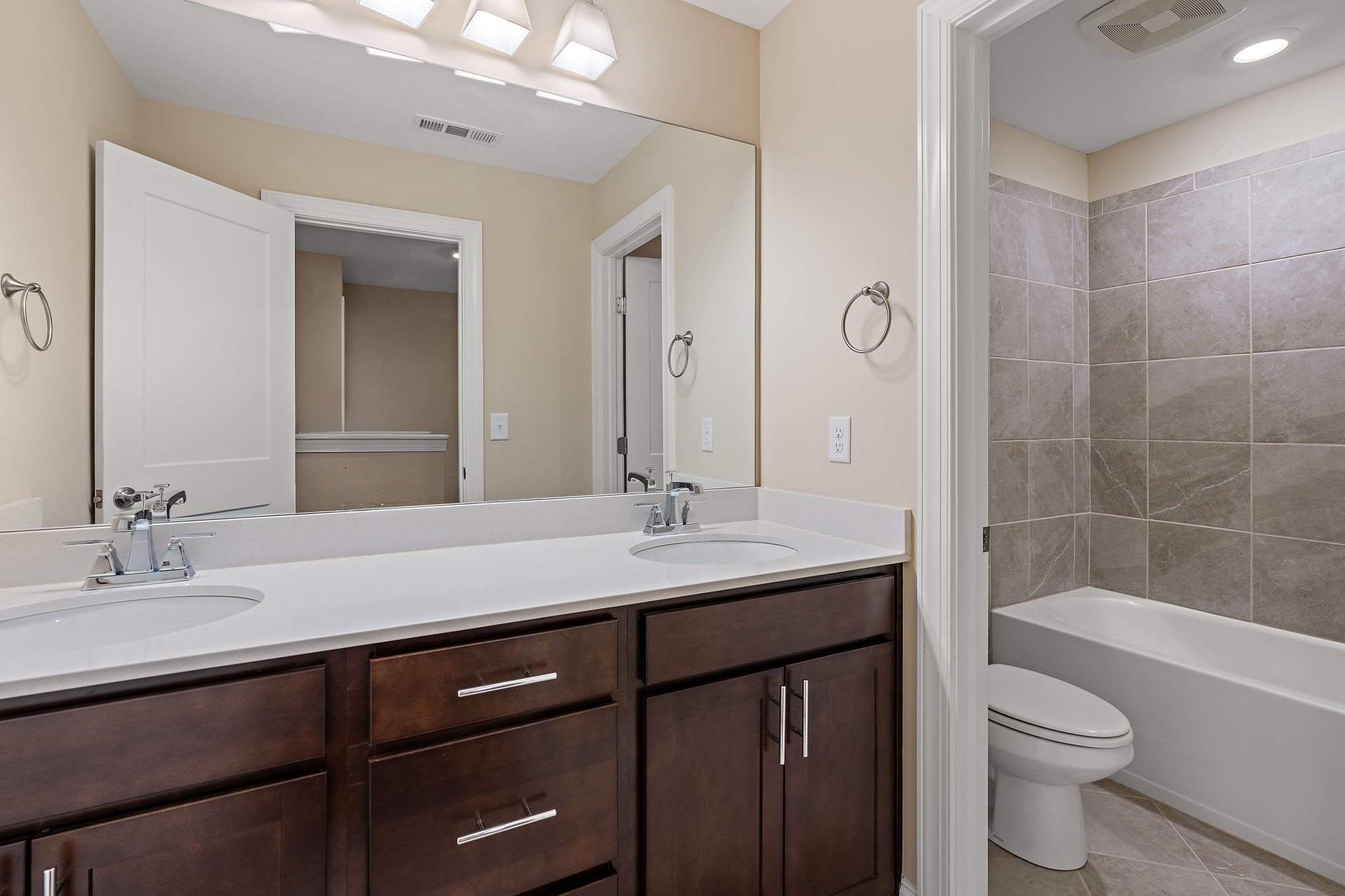 7205 Ragland Place Fairview, TN 37062 - Photo 30 of 36 Here is the 3rd full bathroom. Features double sinks and tiled shower/tub combo!