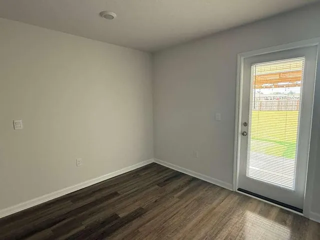 a bathroom view of a toilet and a shower