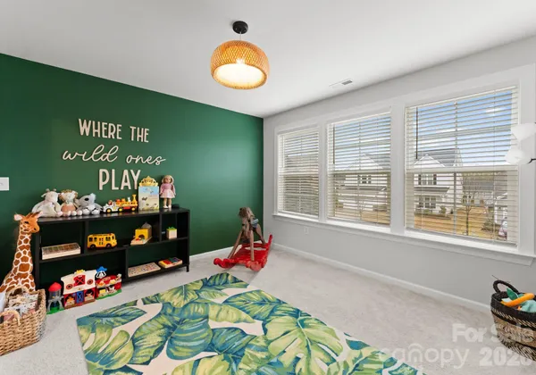 a view of room with furniture and a window
