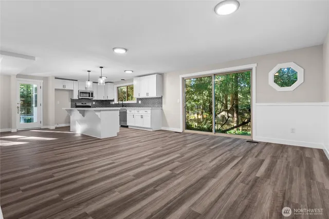 a view of kitchen and wooden floor