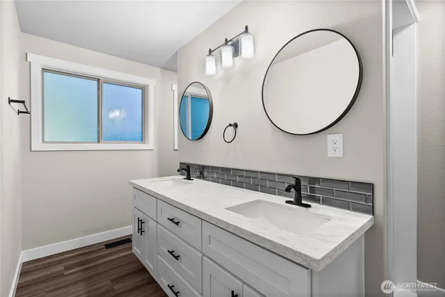 a bathroom with a sink and a mirror