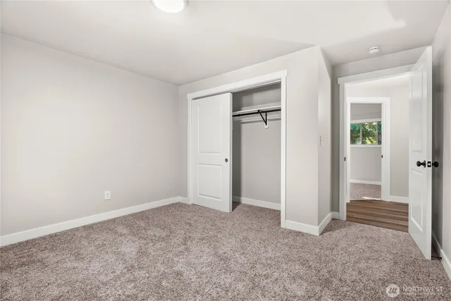 an empty room with closet area