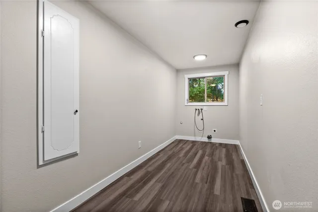 a view of room with window and hardwood floor