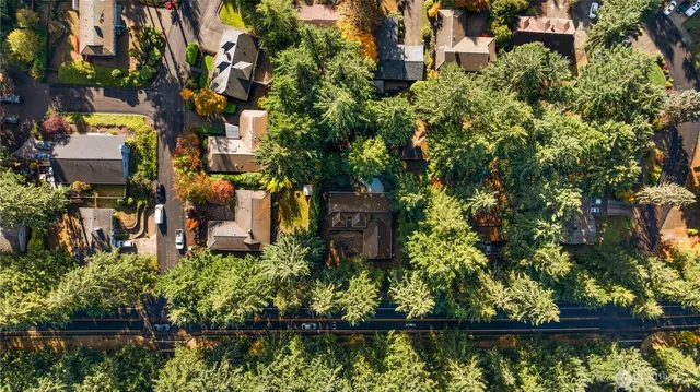 an aerial view of house with yard swimming pool and outdoor seating