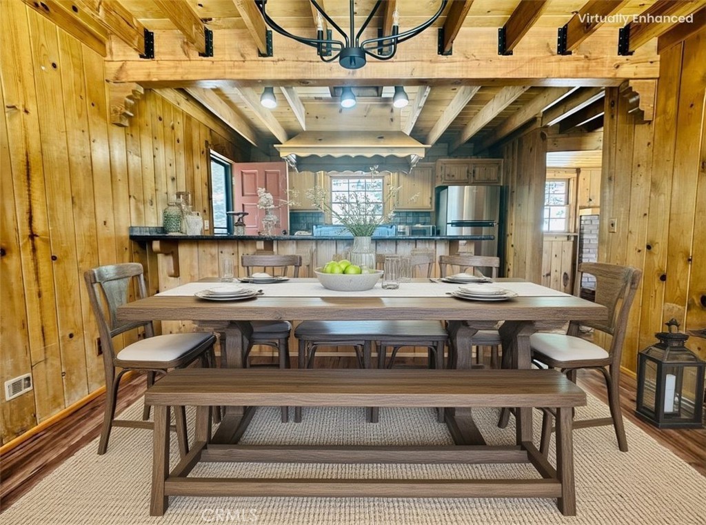 349 Golf Course Road Lake Arrowhead, CA 92352 - Photo 22 of 58 a view of a dining area with furniture window and wooden floor
