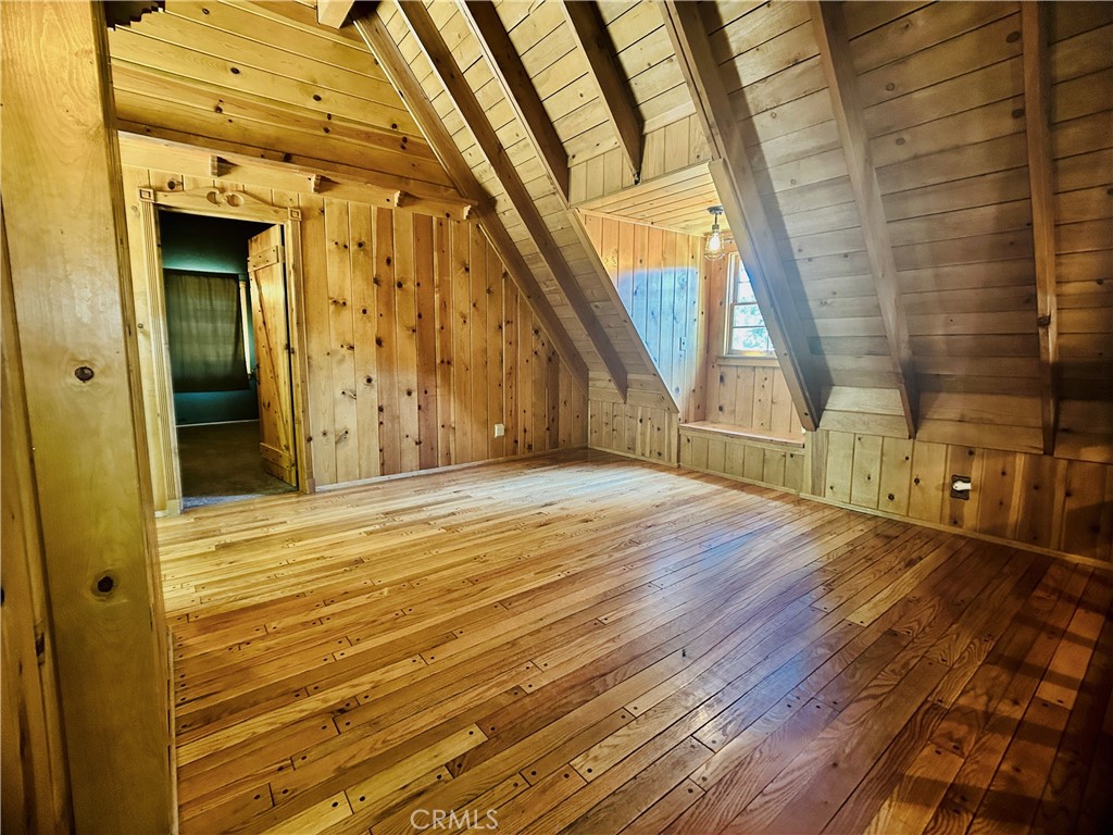 349 Golf Course Road Lake Arrowhead, CA 92352 - Photo 33 of 58 a view of empty room with wooden floor and fan