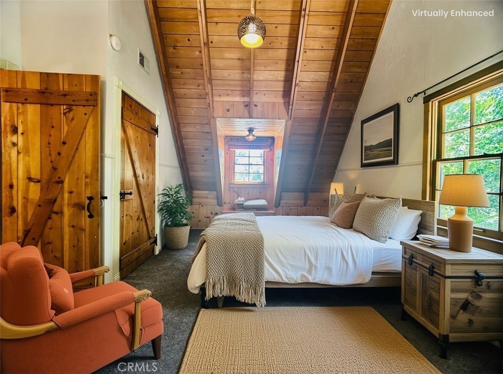 349 Golf Course Road Lake Arrowhead, CA 92352 - Photo 41 of 58 a spacious bedroom with a bed and a window