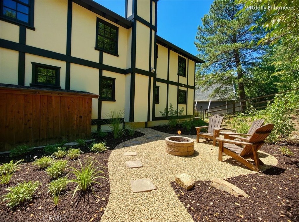 349 Golf Course Road Lake Arrowhead, CA 92352 - Photo 47 of 58 a view of a patio with couches table and chairs and potted plants
