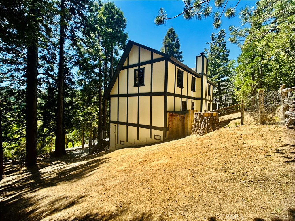 349 Golf Course Road Lake Arrowhead, CA 92352 - Photo 49 of 58 a view of large trees with wooden fence