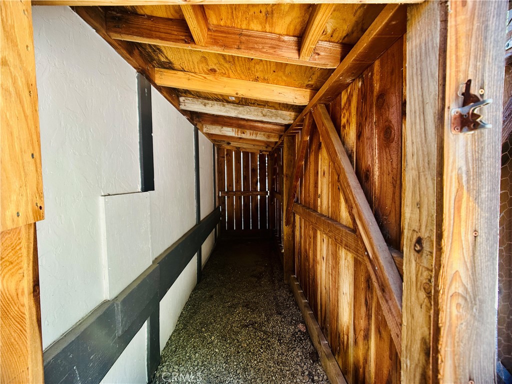 349 Golf Course Road Lake Arrowhead, CA 92352 - Photo 51 of 58 a view of a hallway with wooden floors and stairs
