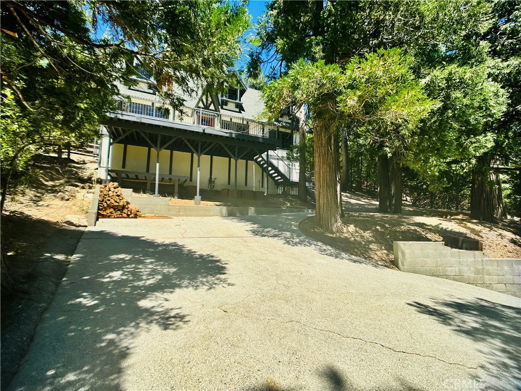 349 Golf Course Road Lake Arrowhead, CA 92352 - Photo 7 of 58 a front view of a house with a yard