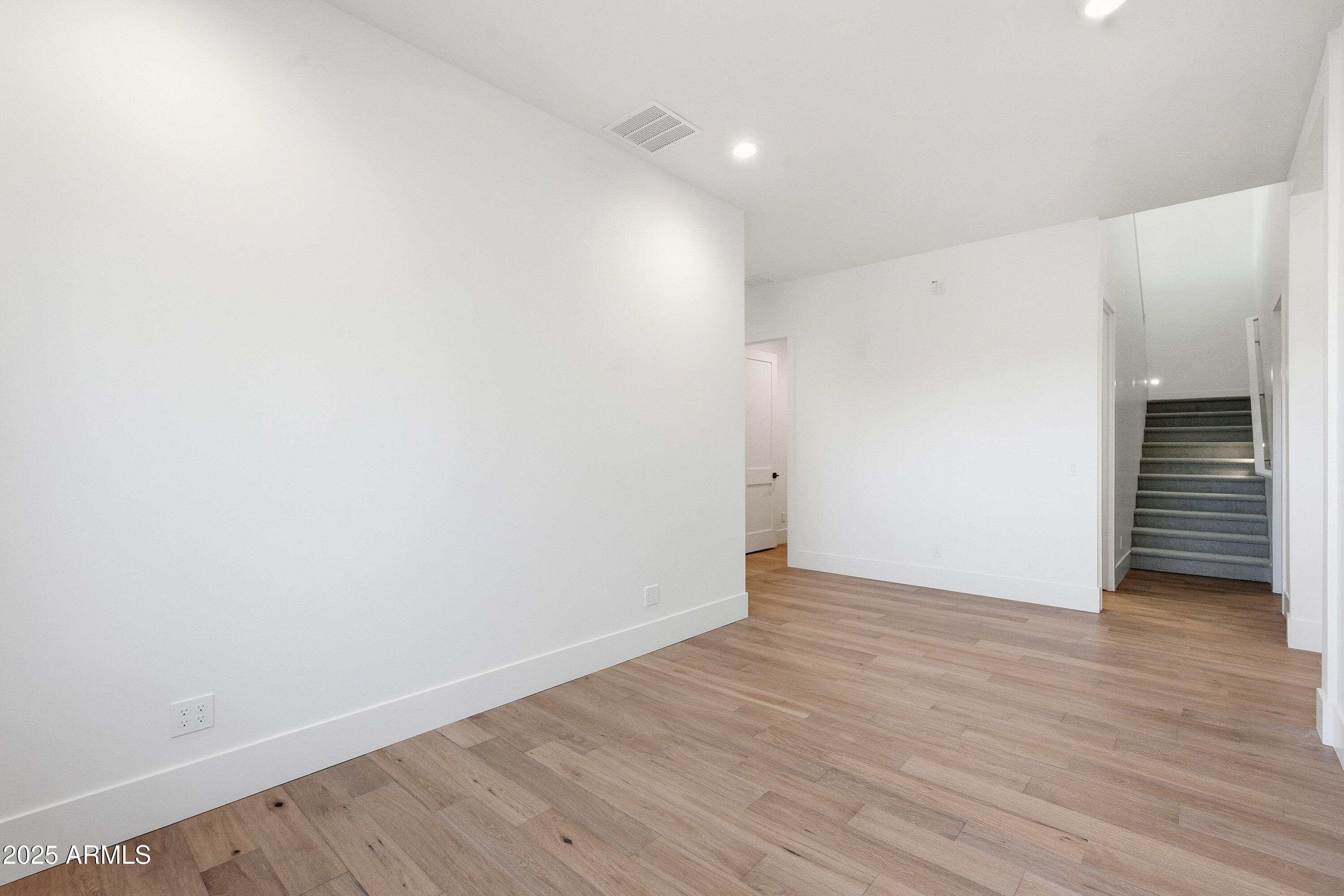 3326 South Stuart Court Gilbert, AZ 85297 - Photo 48 of 88 a view of an empty room with wooden floor and closet